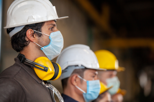 Masked engineers on job site during pandemic
